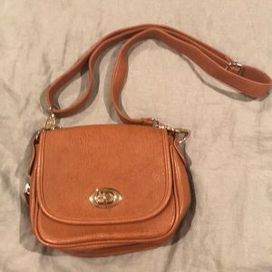 Francesca’s brown leather crossbody bag